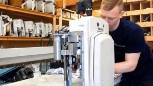 Skilled engineers reconditioning straight and curved stairlifts